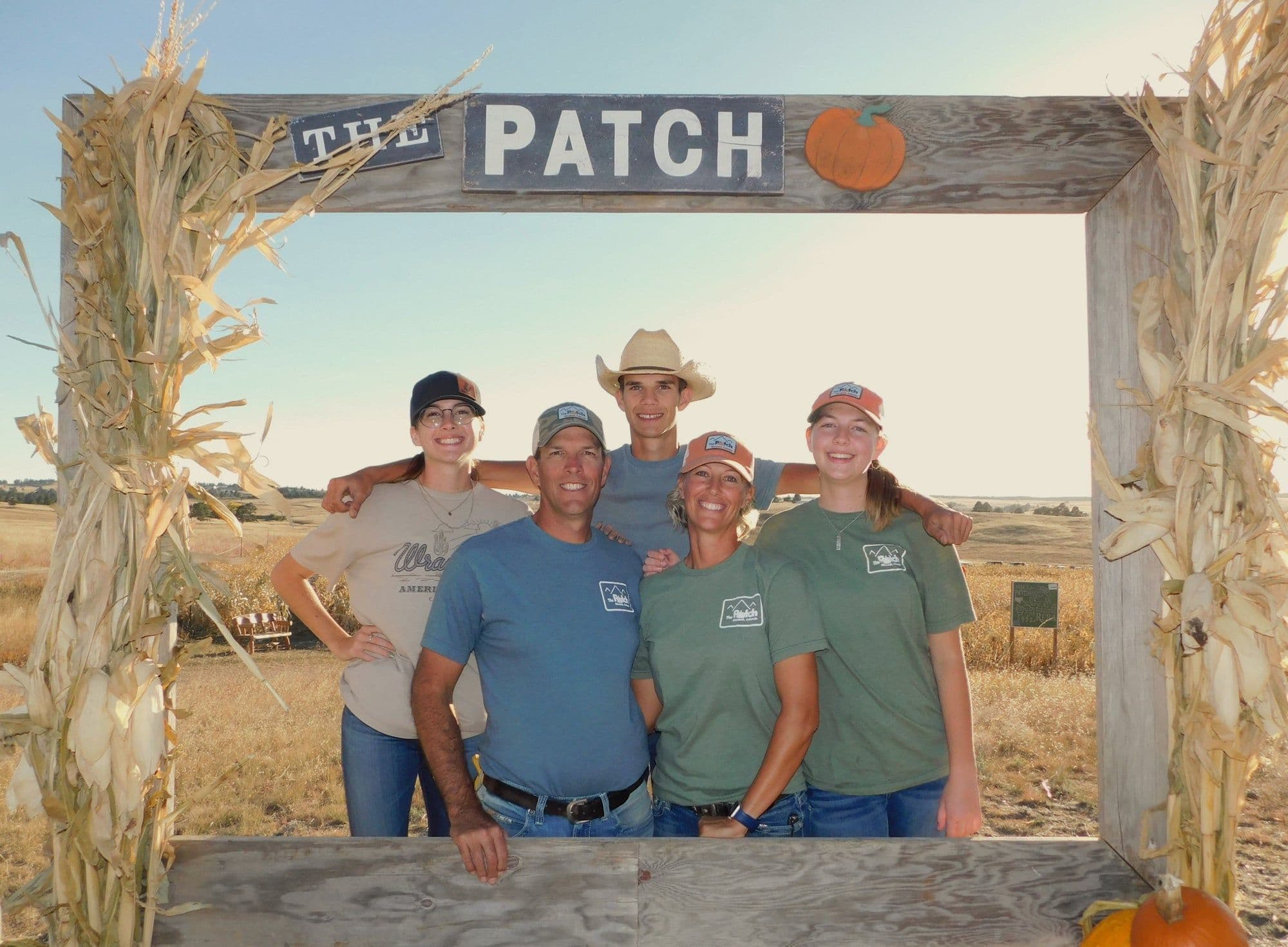 The Smith family under the entrance arch at The Patch